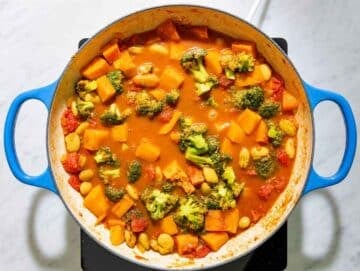 Step 2 Butter beans, diced sweet potatoes, tomatoes, and broccoli simmering together in the spiced curry sauce.