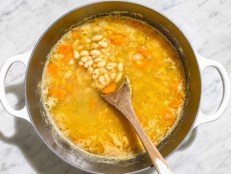 Step 2 Cannellini beans simmering in vegetable broth with tender vegetables.