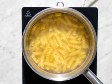 Step 2 Fusilli cooking until al dente in a pot of salted water.