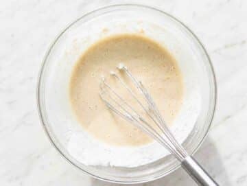 Step 2 Mashed bananas mixed with Greek yogurt, milk, and vanilla until smooth.