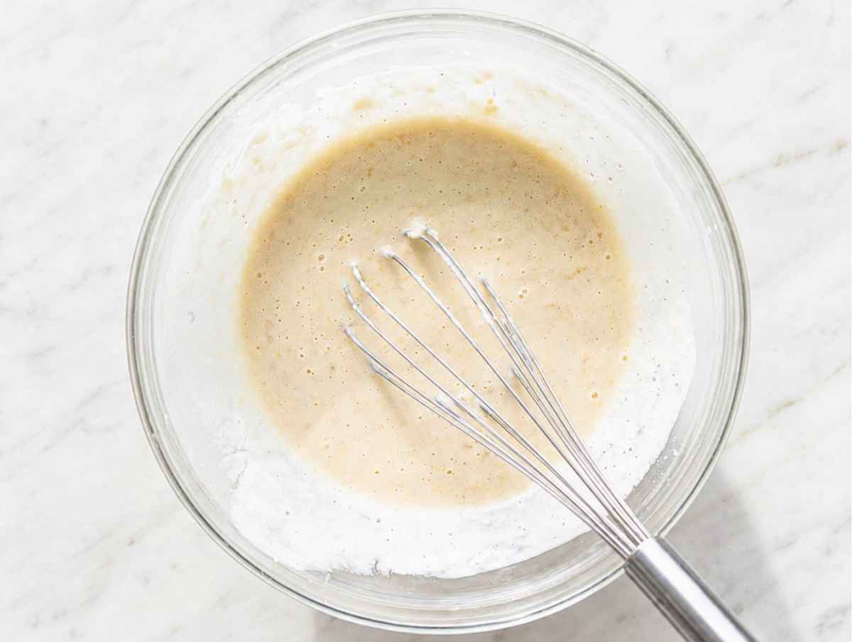 Step 2 Mashed bananas mixed with Greek yogurt, milk, and vanilla until smooth.