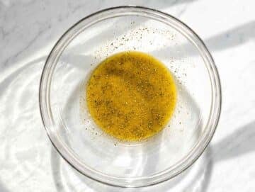 Step 2 Oregano vinaigrette whisked with olive oil, vinegar, mustard, and honey.