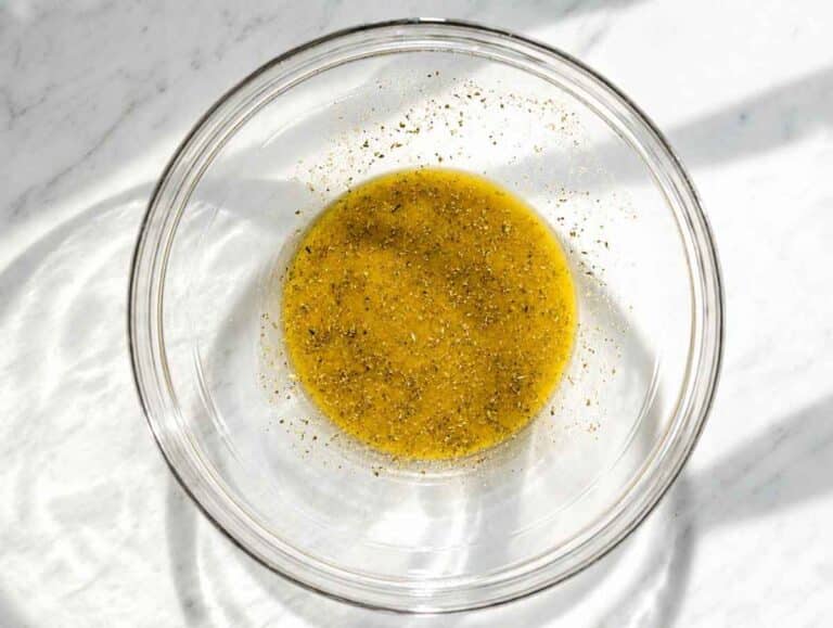 Step 2 Oregano vinaigrette whisked with olive oil, vinegar, mustard, and honey.