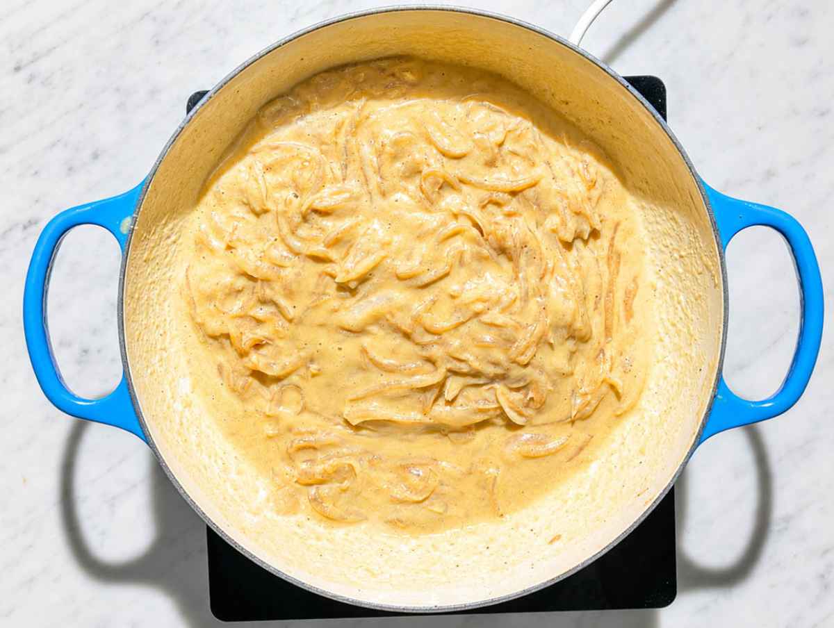 Step 3 Hummus and pasta water stirred into onions until smooth and creamy.