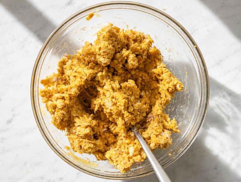Step 3 Parmesan, egg, onion, garlic, oregano, and paprika mixed into mashed chickpeas.