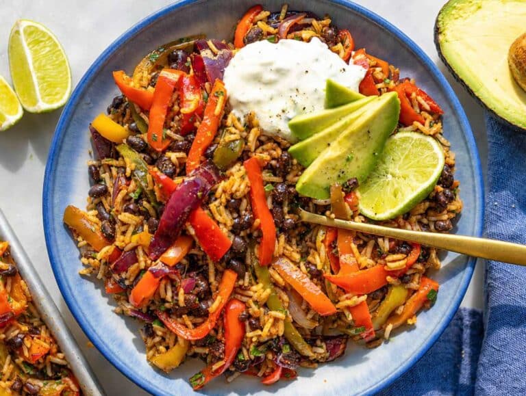 Step 4 Black bean fajita bowl topped with avocado, yogurt, and fresh cilantro.