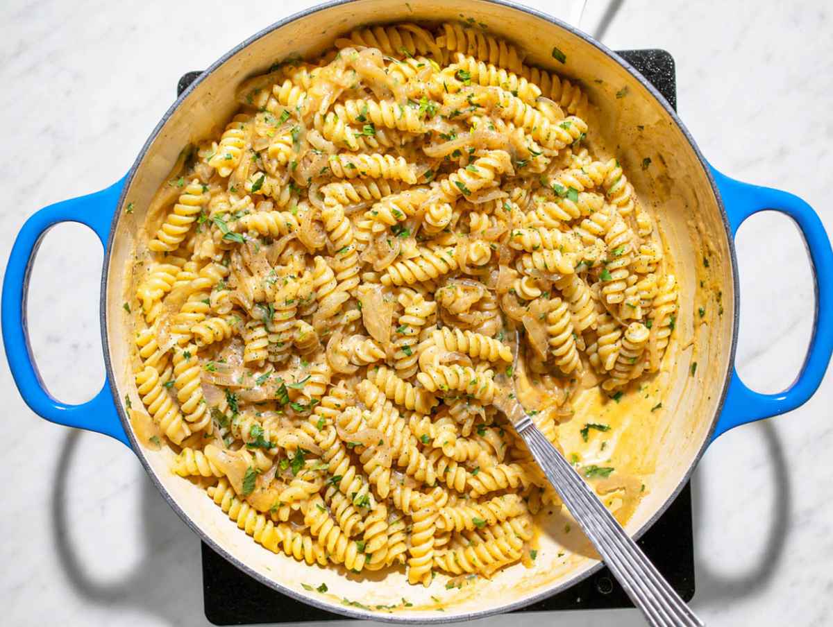 Step 4 Fusilli tossed with creamy caramelized onion sauce, parsley, and black pepper.