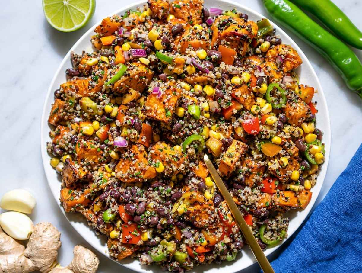 Step 4 Quinoa, roasted sweet potatoes, beans, corn, and vegetables tossed together