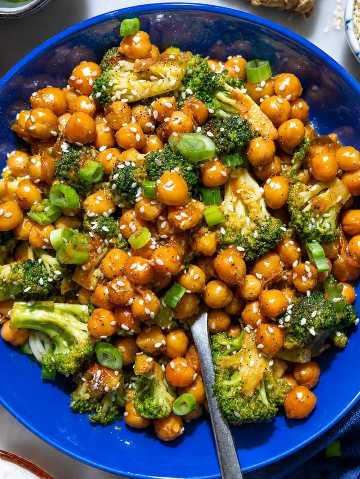 Sticky sesame chickpeas with charred broccoli and scallions.