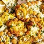 Tandoori cauliflower with roasted cauliflower, chickpeas, basmati rice, and spatula.
