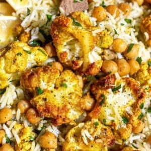 Tandoori cauliflower with roasted cauliflower, chickpeas, basmati rice, and spatula.