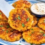 Chickpea Butternut Squash Patties with crisp edges and creamy yogurt sauce.