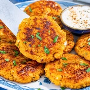 Chickpea Butternut Squash Patties with crisp edges and creamy yogurt sauce.