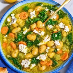 Golden lemon butter bean soup topped with feta and olive oil