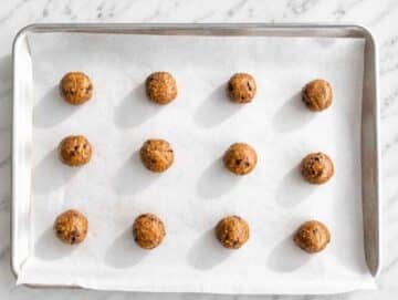 Step 2 Cookie dough balls spaced apart on a parchment-lined baking sheet.