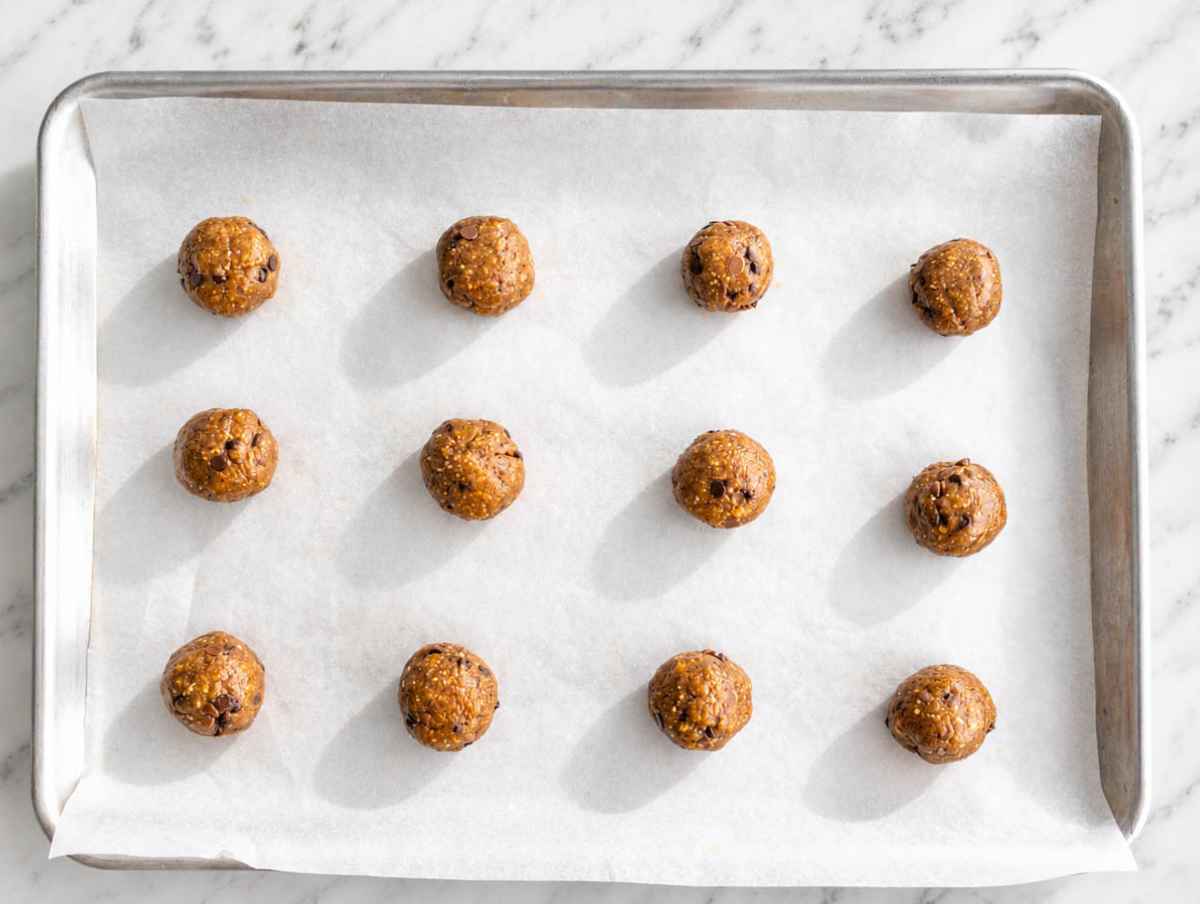 Step 2 Cookie dough balls spaced apart on a parchment-lined baking sheet.