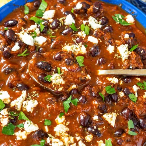 Birria-inspired black bean stew with rice, feta, cilantro, and lime.