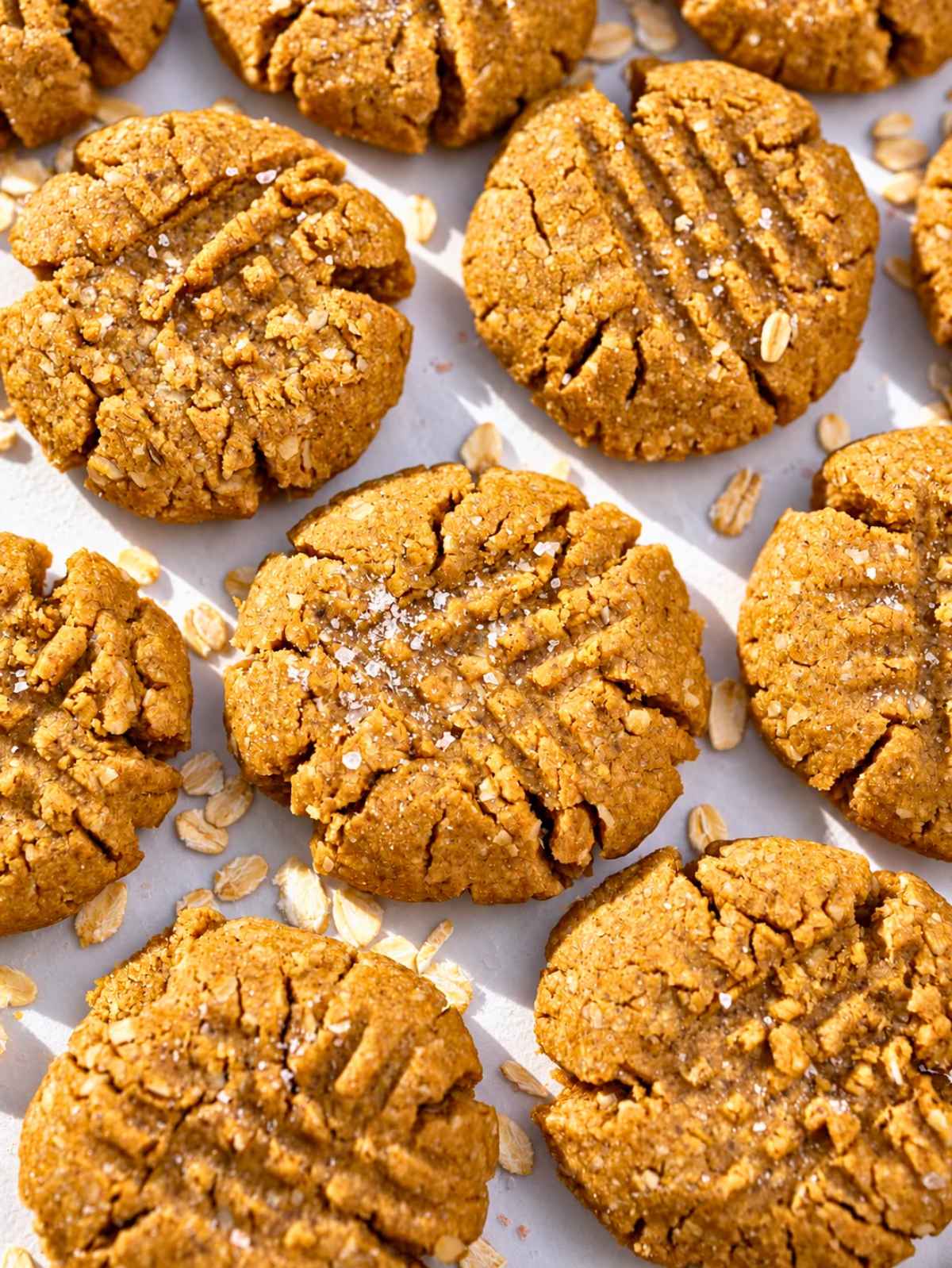 Close-up of a peanut butter cookie showing its rustic, crumbly texture.