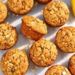 Freshly baked banana oatmeal raisin muffins arranged on table.