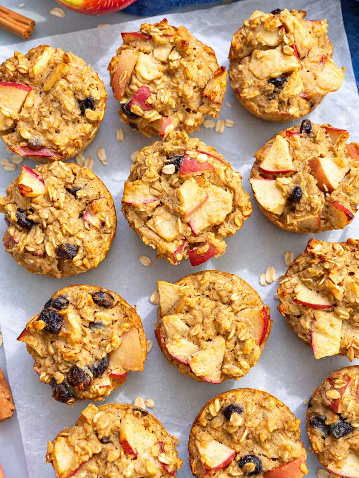 Golden baked apple oatmeal cups with visible apple chunks and oats.