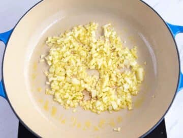 Step 1 Chopped onion softening in olive oil in a large skillet.