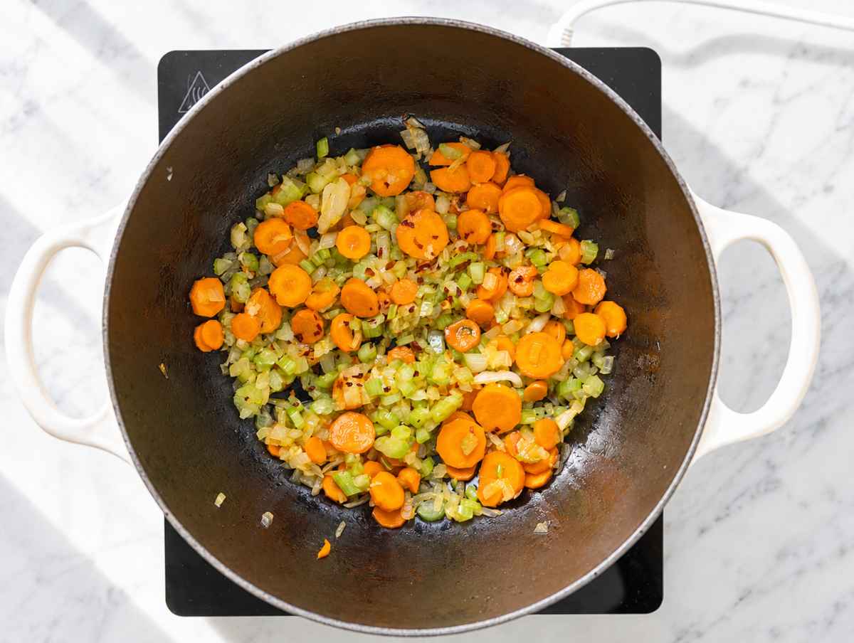 Step 1 Onion, carrots, and celery sautéing with garlic and red pepper flakes.