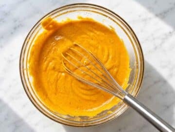 Step 1 Pumpkin puree, eggs, Greek yogurt, oil, sugar, and vanilla whisked smooth.