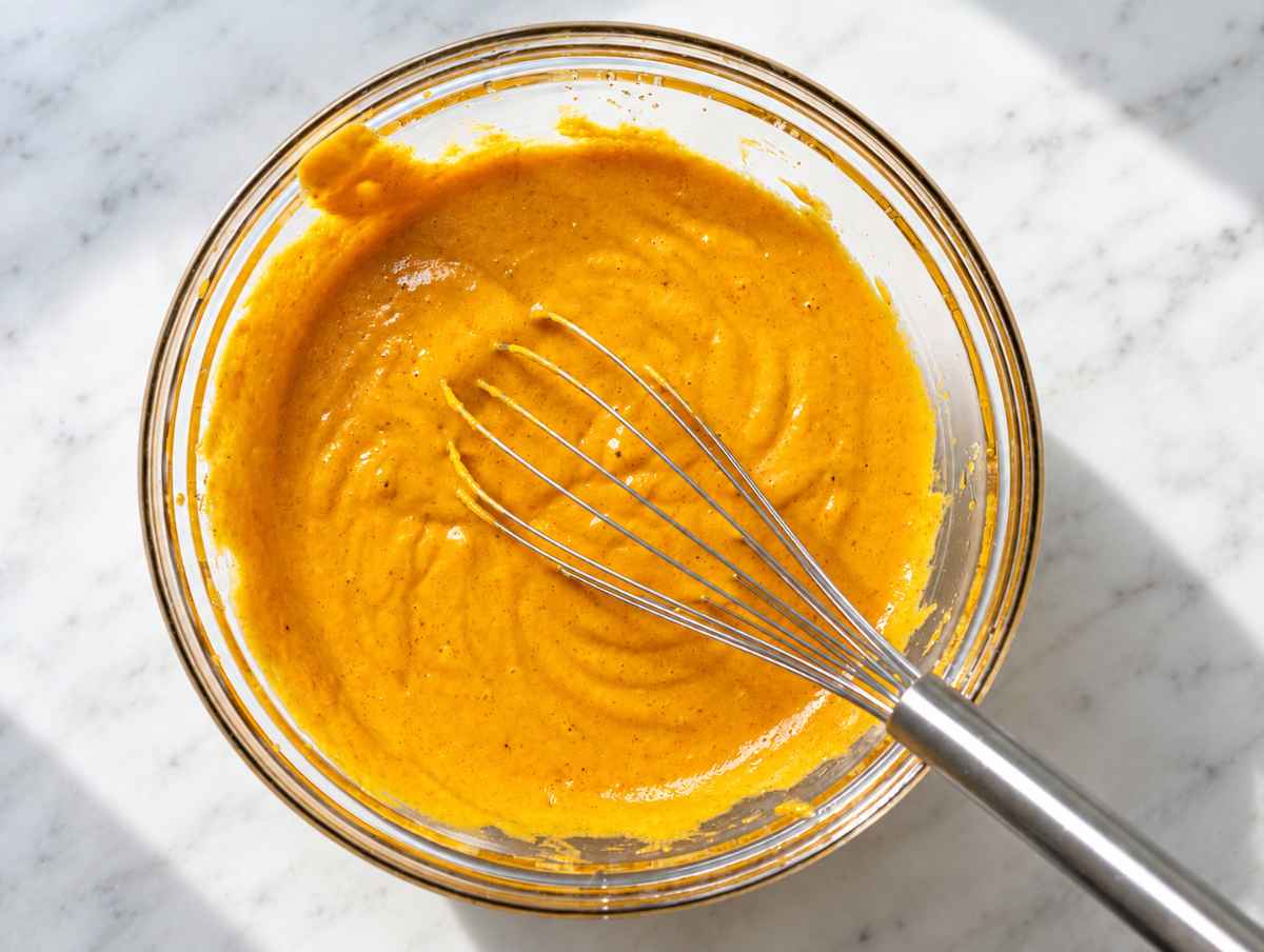 Step 1 Pumpkin puree, eggs, Greek yogurt, oil, sugar, and vanilla whisked smooth.