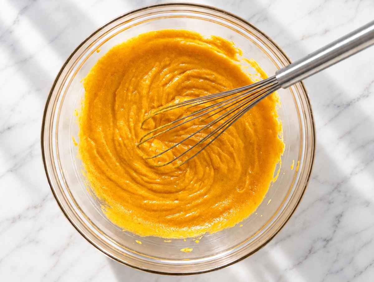 Step 1 Pumpkin puree, yogurt, sugar, oil, egg, and vanilla whisked until smooth.