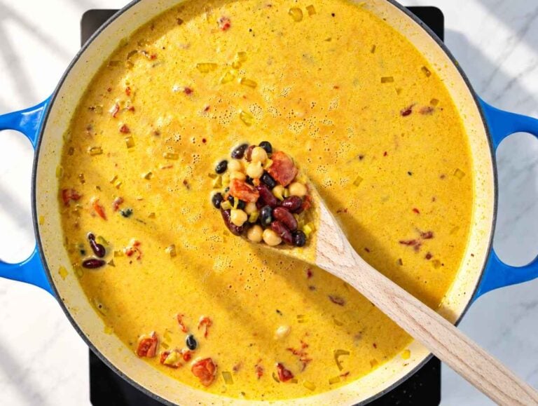 Step 2 Black beans, kidney beans, and chickpeas stirred into the tomato coconut sauce.