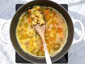 Step 2 Cannellini beans and vegetables simmering in broth until tender.