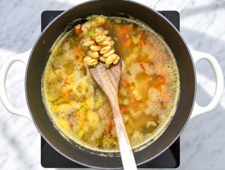 Step 2 Cannellini beans and vegetables simmering in broth until tender.