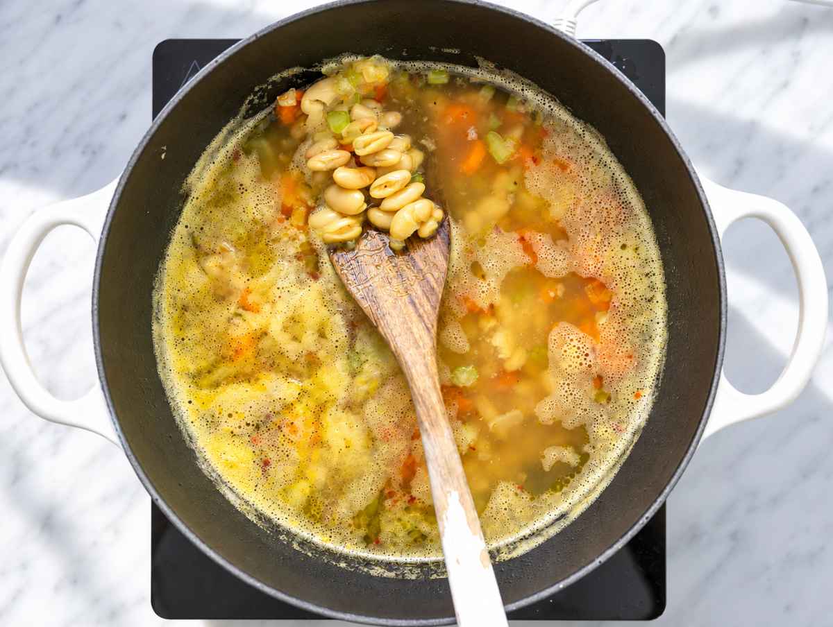 Step 2 Cannellini beans and vegetables simmering in broth until tender.