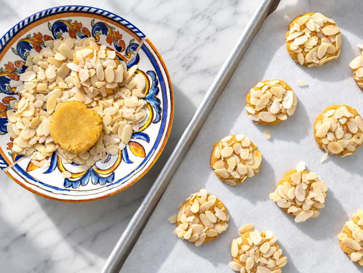 Step 2 Cookie dough shaped into thick rounds and topped with sliced almonds.