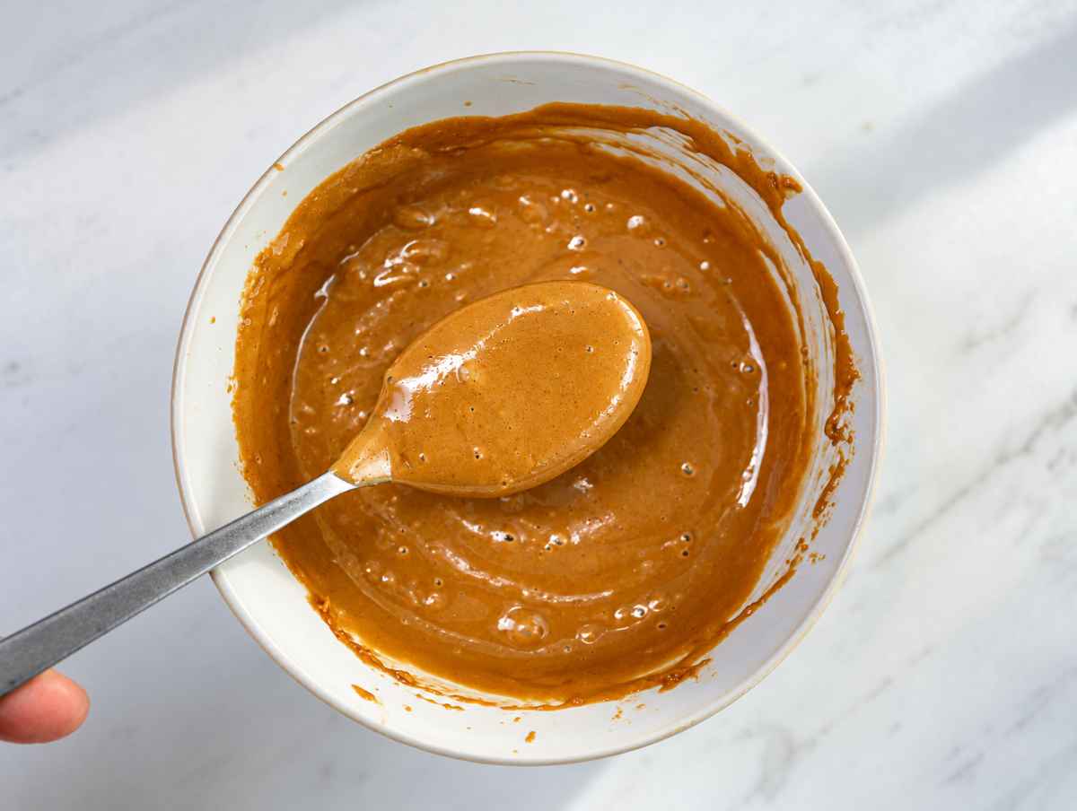 Step 2 Smooth peanut sauce in a bowl with a spoon.
