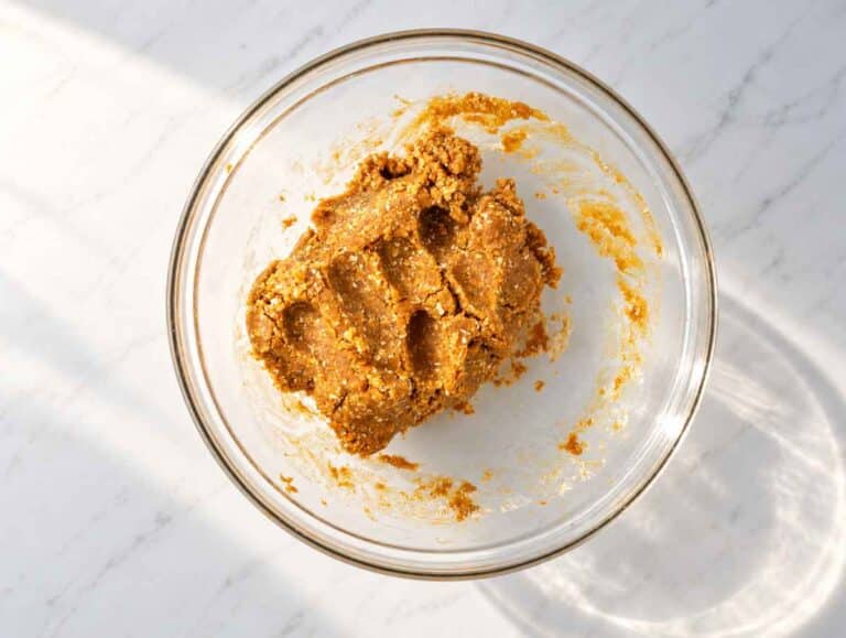 Step 2 Thick peanut butter cookie dough coming together in a mixing bowl.