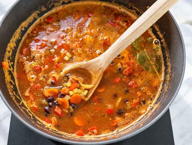 Step 3 Black beans simmering with vegetables in reddish tomato broth.