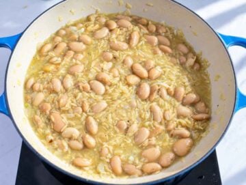 Step 3 Butter beans and orzo simmering together in creamy vegetable broth.