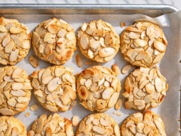 Step 3 Freshly baked cookies with golden edges and lightly toasted sliced almonds.