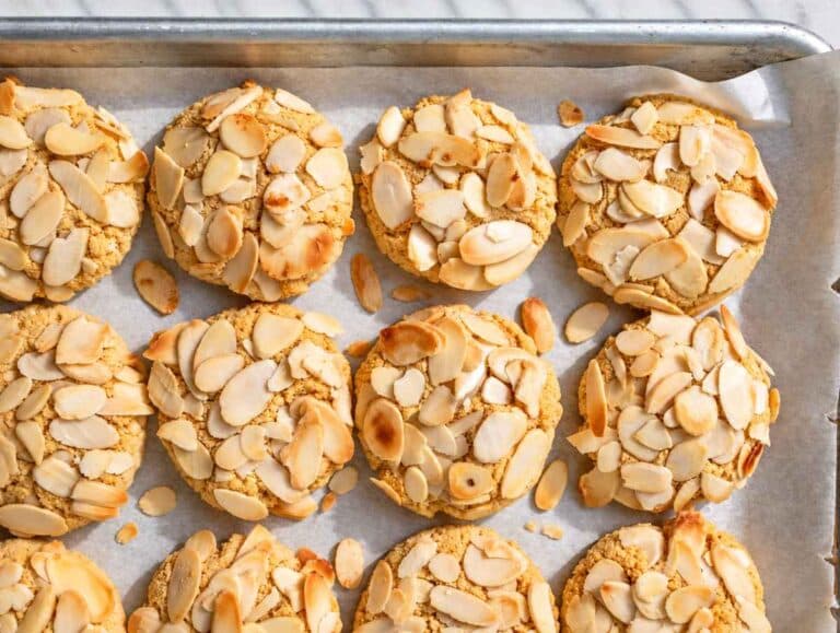 Step 3 Freshly baked cookies with golden edges and lightly toasted sliced almonds.