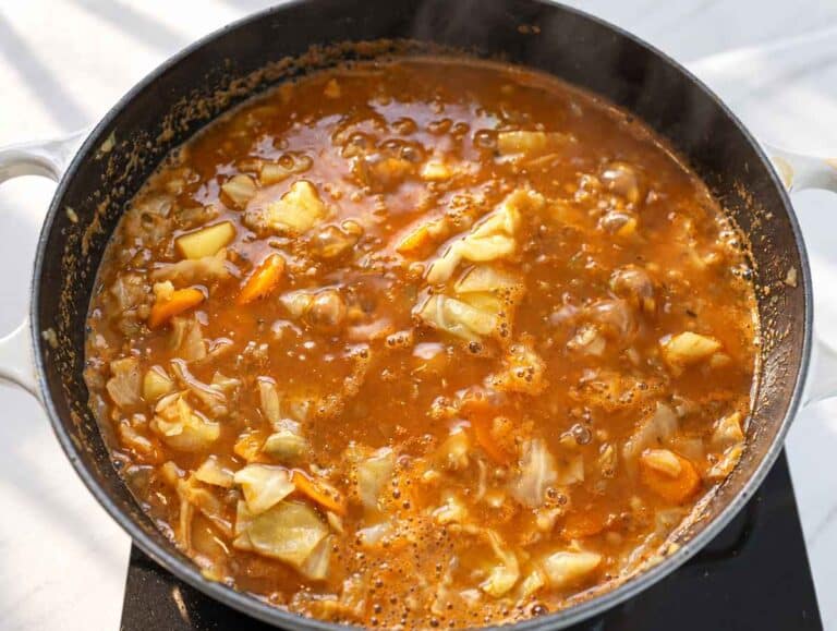 Step 3 Lentils, potatoes, and cabbage simmering together in a tomato broth.