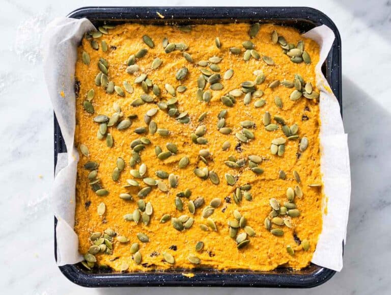 Step 3 Raisins folded into pumpkin batter and topping with crunchy pumpkin seeds.
