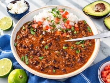 Step 4 Black bean stew over rice topped with onion, and cilantro.