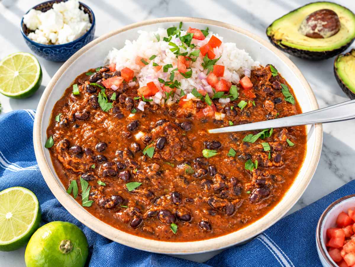 Step 4 Black bean stew over rice topped with onion, and cilantro.