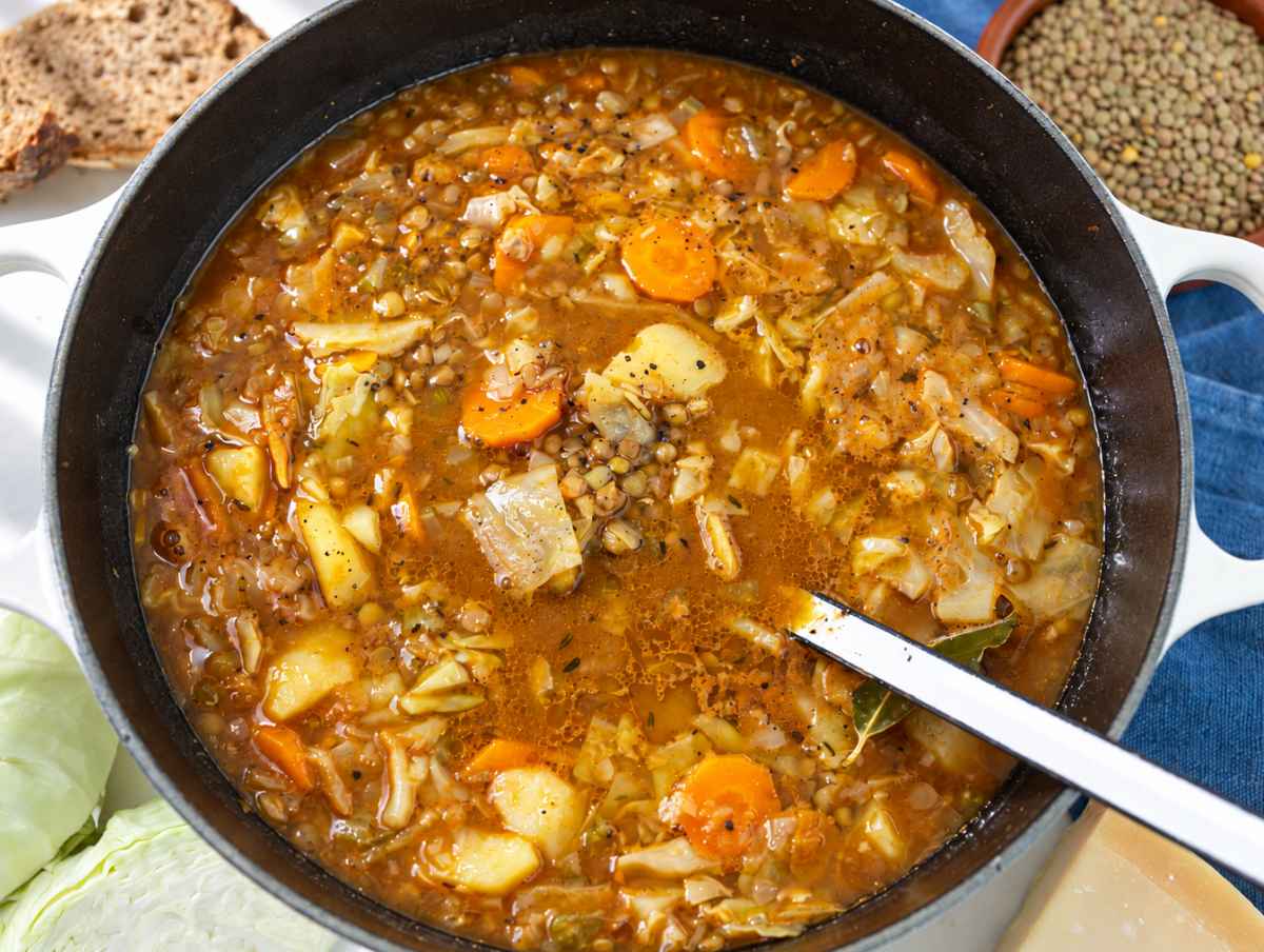 Step 4 Finished cabbage lentil soup with tender potatoes and vegetables in the pot.