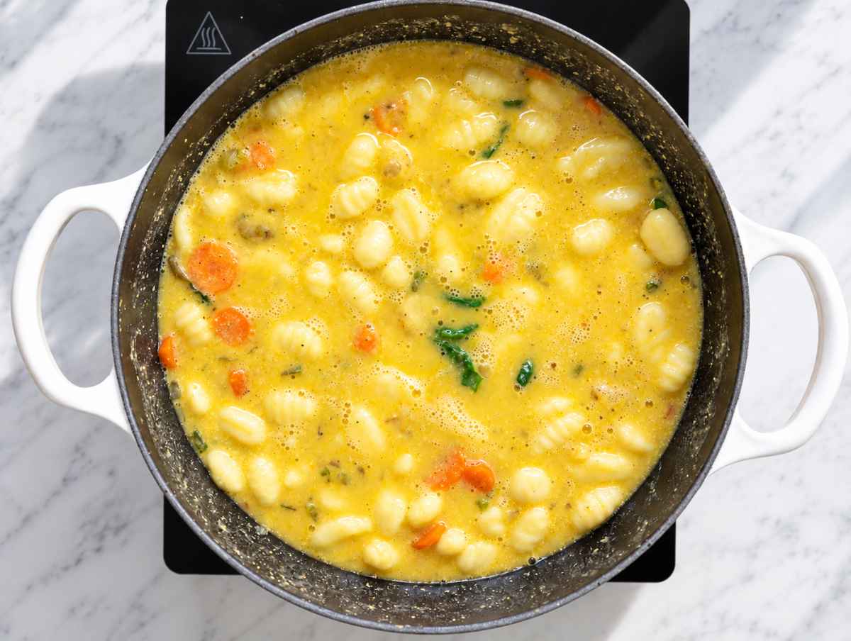 Step 4 Potato gnocchi simmering in creamy white bean and vegetable soup.