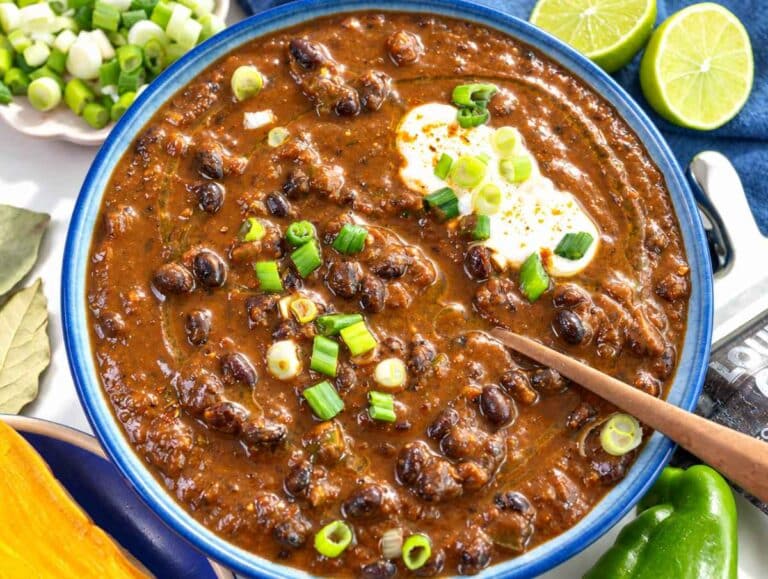Step 5 Finished black bean soup topped with sliced green onions and fresh lime.