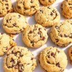 Thick, bakery-style almond flour cookies on parchment paper.