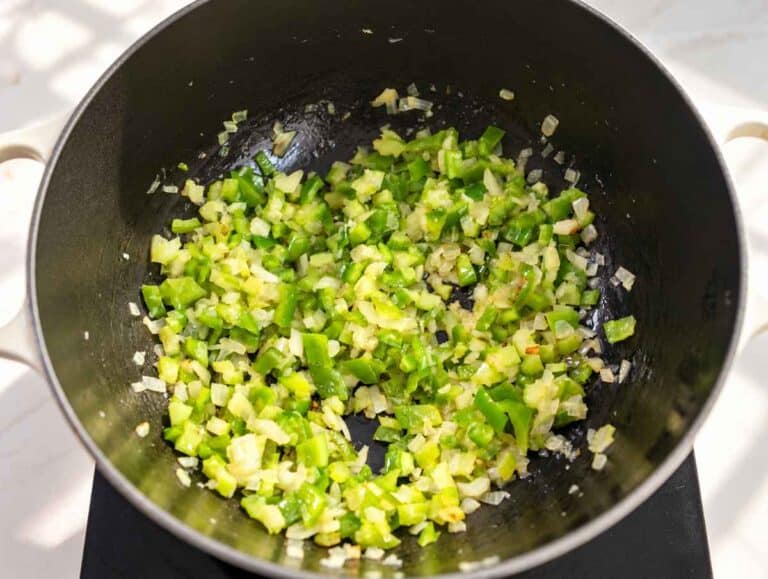 step 1 Chopped onion, celery, and green bell pepper softening in a pot.